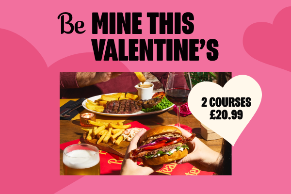 Beefeater Baconeater Burger with fries and a glass of wine.